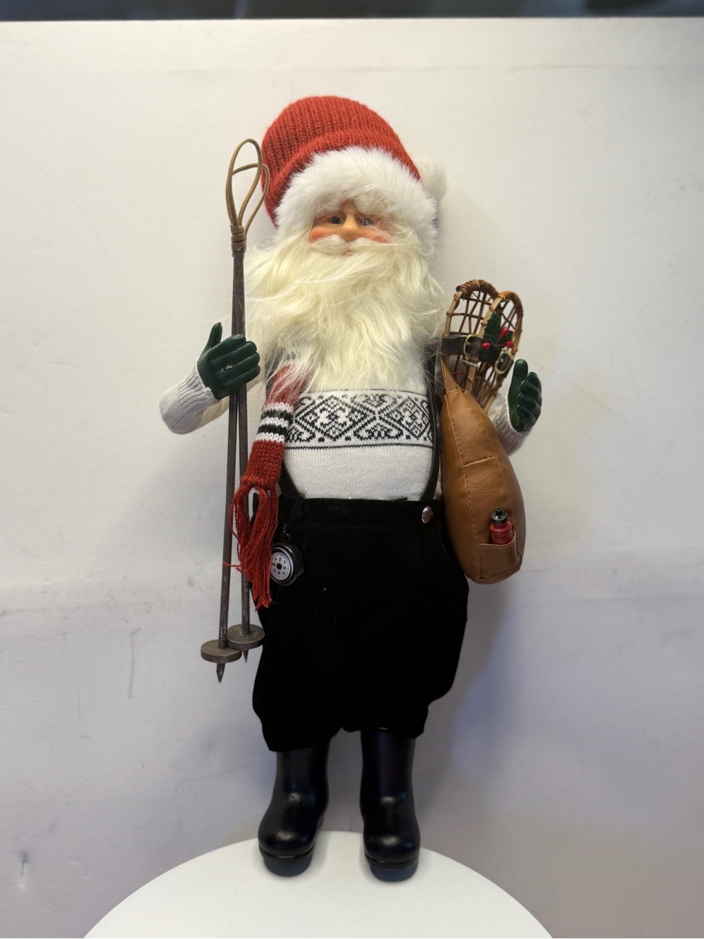 Santa Figurine with Red Knit Hat and Ski Accessories